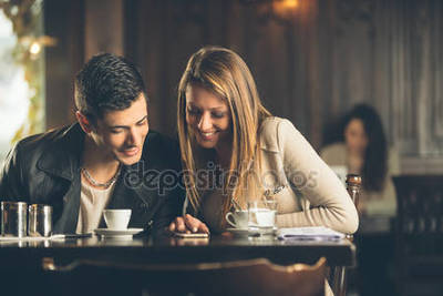 https://st2.depositphotos.com/3889193/7173/i/450/depositphotos_71734845-stock-photo-friends-at-the-cafe-using.jpg